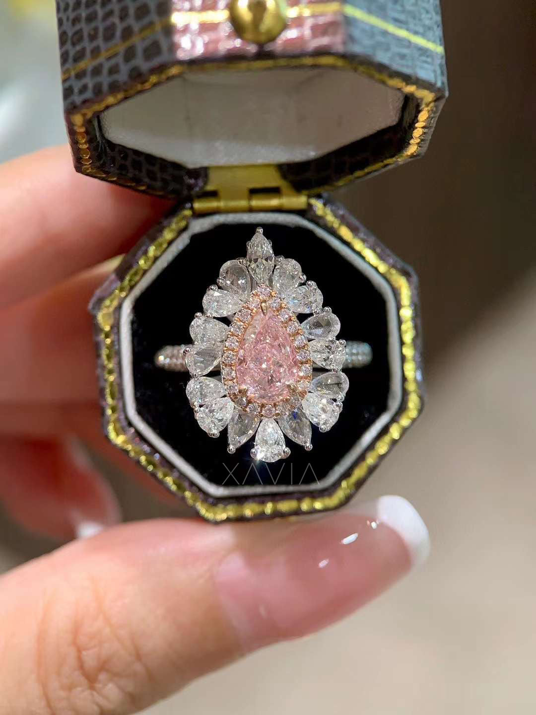 side profile of floral-inspired pink pear diamond halo ring with clustered marquise and pear diamonds